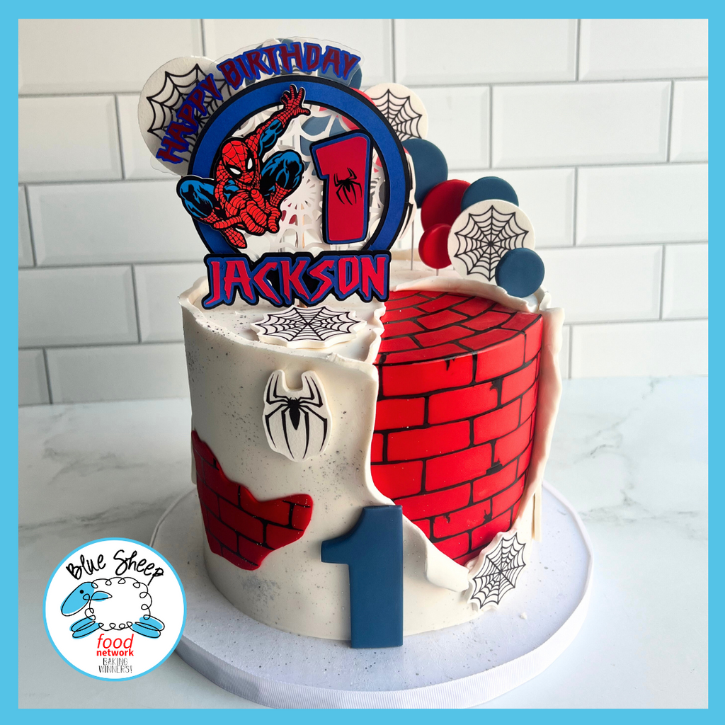 Themed birthday cake with superhero-inspired decorations, personalized with a child's name and age, perfect for a heroic celebration.