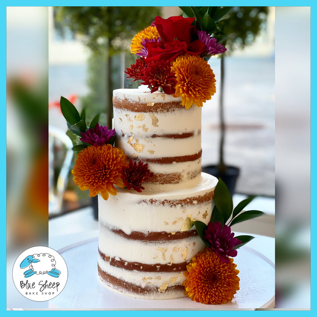 Naked Wedding Cake With Fall Blooms