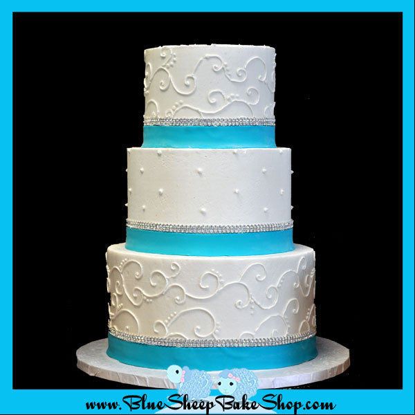 filagree wedding cake with tiffany blue bands and crystal banding