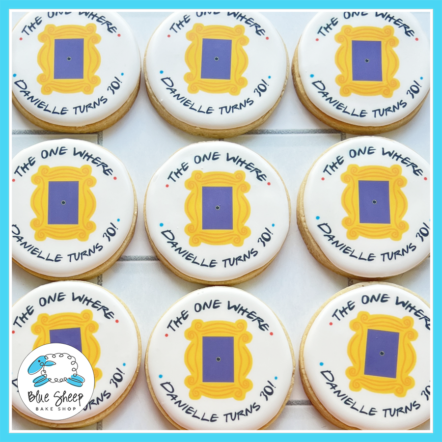 Friends-themed birthday cookies with custom text reading “The One Where Danielle Turns 30!” printed on white iced sugar cookies

