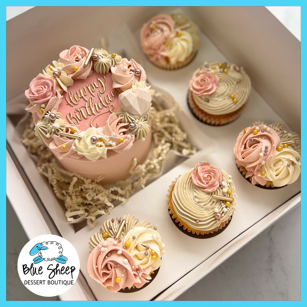 Blush Blossoms Birthday Bento Box with a mini cake and floral-themed cupcakes