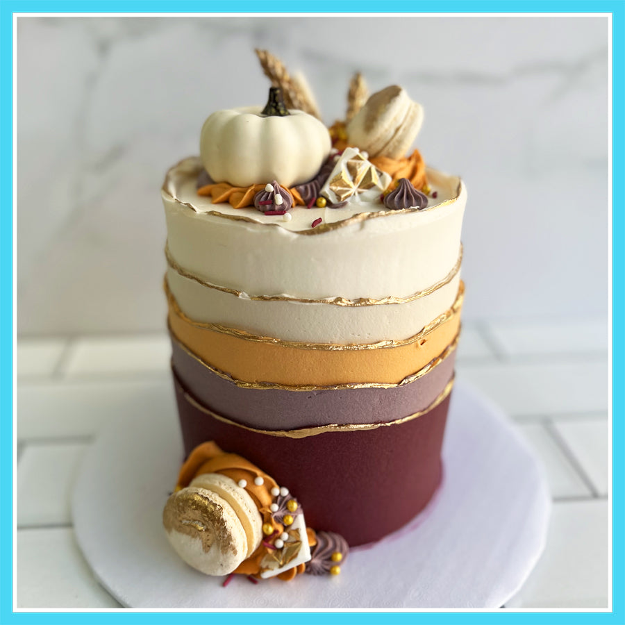 Fall Ombre Waves Birthday Cake with gold accents and autumn decorations