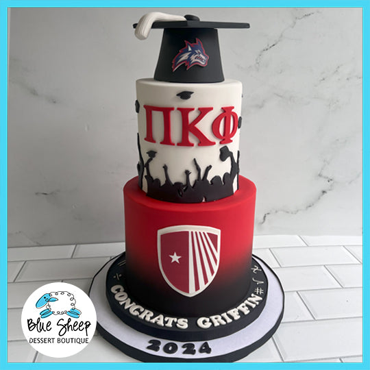 Custom Stony Brook University graduation cake with graduation cap topper, university emblem, and personalized message, delivered by Blue Sheep Dessert Boutique.