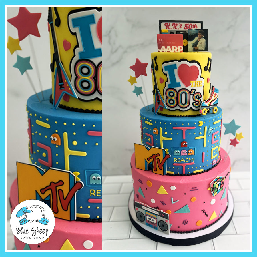 Custom 'I Love the '80s' birthday cake with Pac-Man, MTV logo, boom box, and retro designs by Blue Sheep Bake Shop in Somerville, NJ.