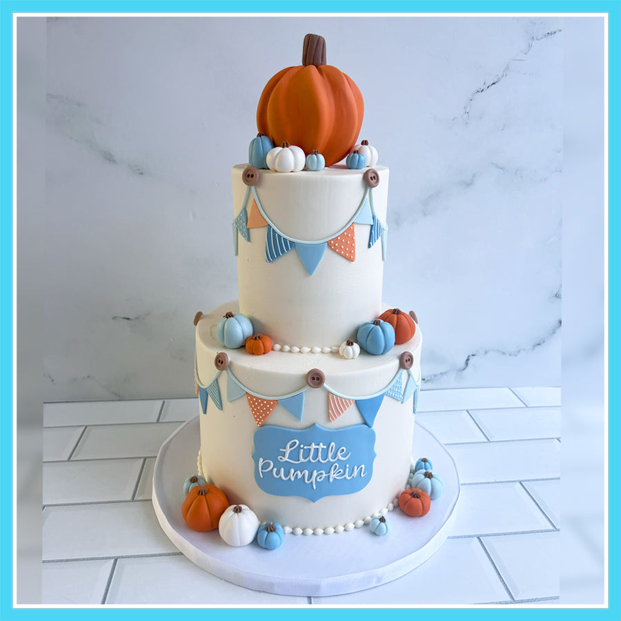 Little Pumpkin baby shower custom cake with fondant pumpkins, bunting decorations, and fall-themed design