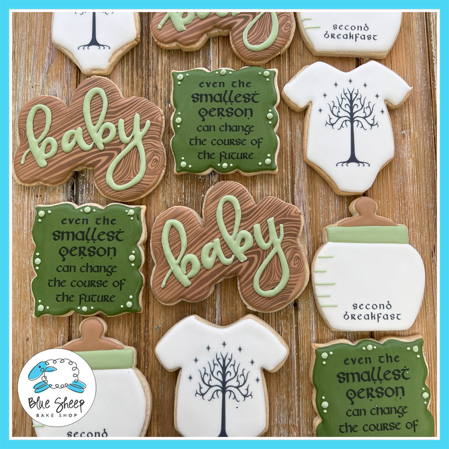 Lord of the Rings-themed baby shower cookies with Tree of Gondor, "smallest person" quote, baby onesies, and bottles.