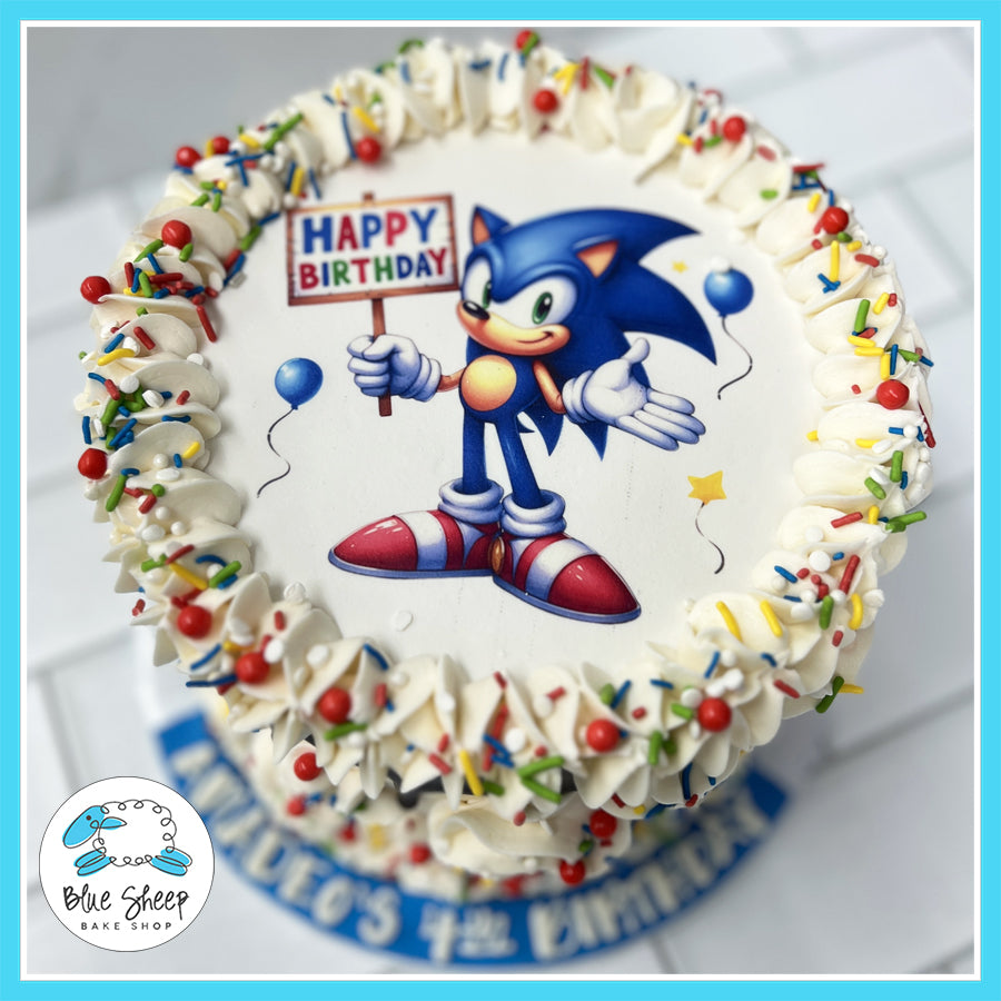 Custom Sonic the Hedgehog birthday cake with edible image topper, colorful sprinkles, and whipped buttercream frosting from Blue Sheep Bake Shop in Somerville, NJ