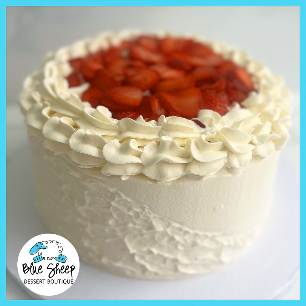 Strawberry Shortcake Angel Food Cake with whipped cream and fresh strawberries