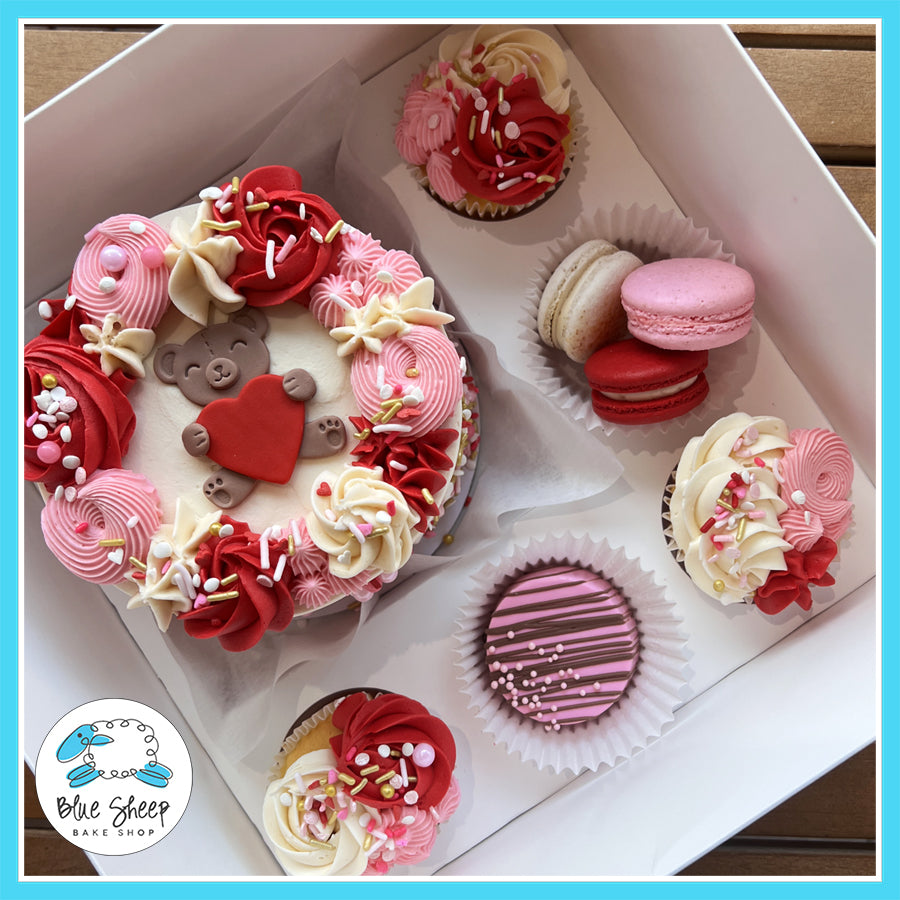 Valentine’s Day Bento Box Gift Set with three cupcakes, a chocolate-covered Oreo, and three French macarons from Blue Sheep Bake Shop in Somerville, NJ