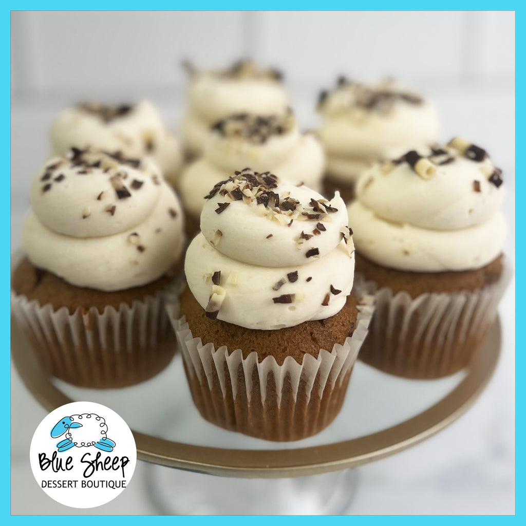 Carrot cake cupcakes with cream cheese frosting, infused with cinnamon & spices 