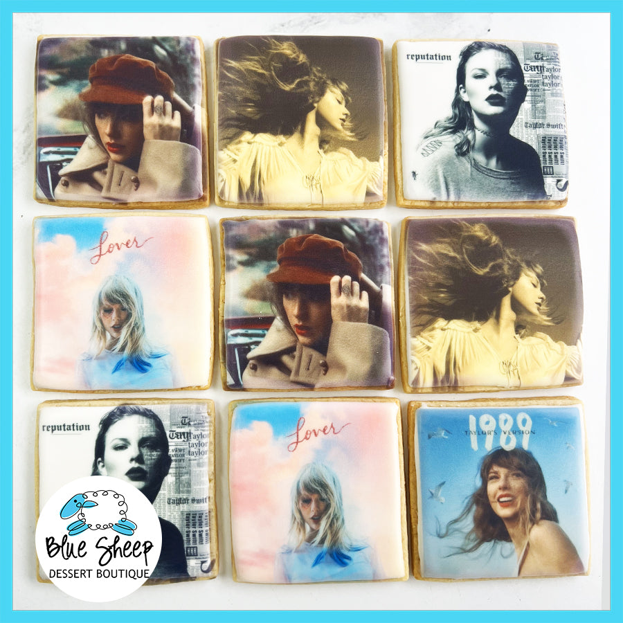 A collection of square decorated cookies with printed edible images of various album covers, perfect for party favors or music-themed gatherings.