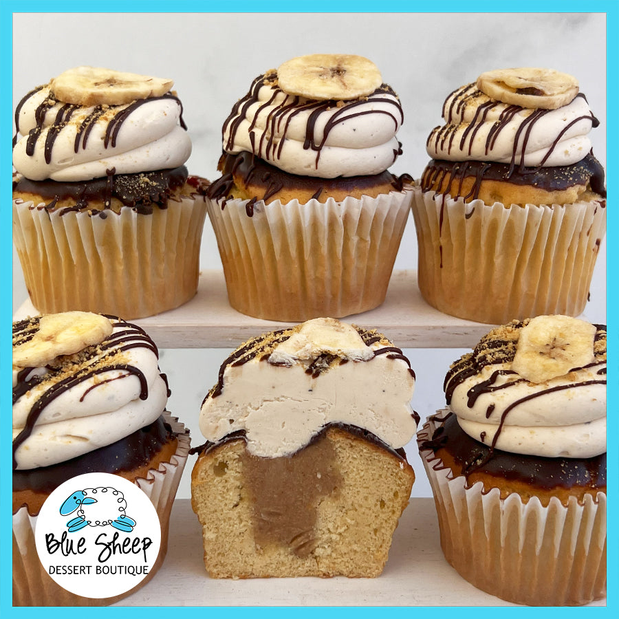 Banana S'mores Cupcakes with graham butter filling, chocolate ganache, & toasted marshmallow 