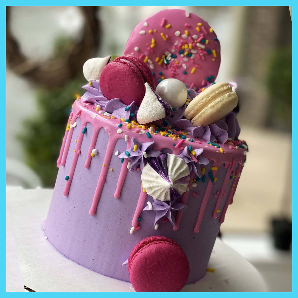 purple and pink donut bakery to go cake