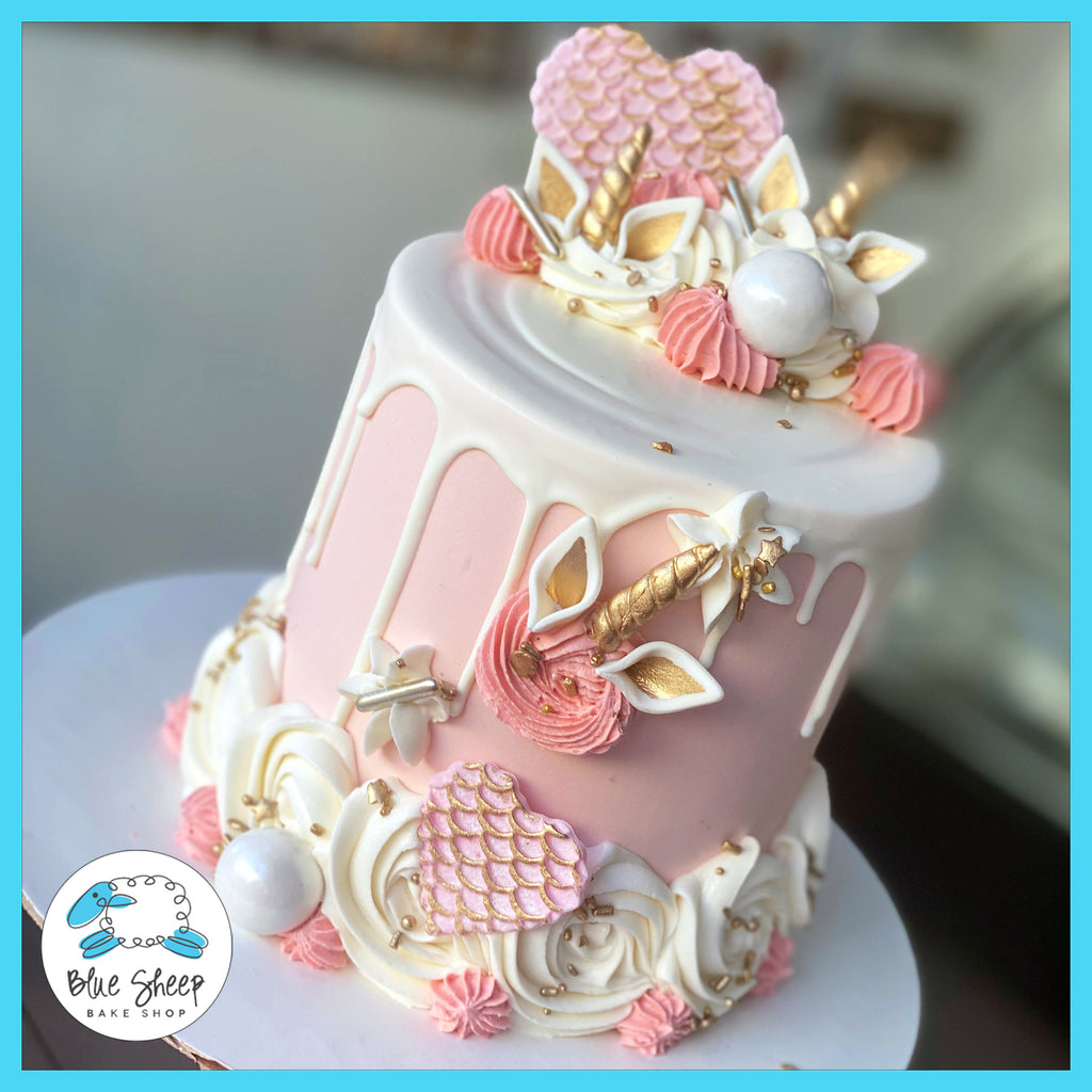 blush unicorn to go cake with chocolate drip nj custom cake