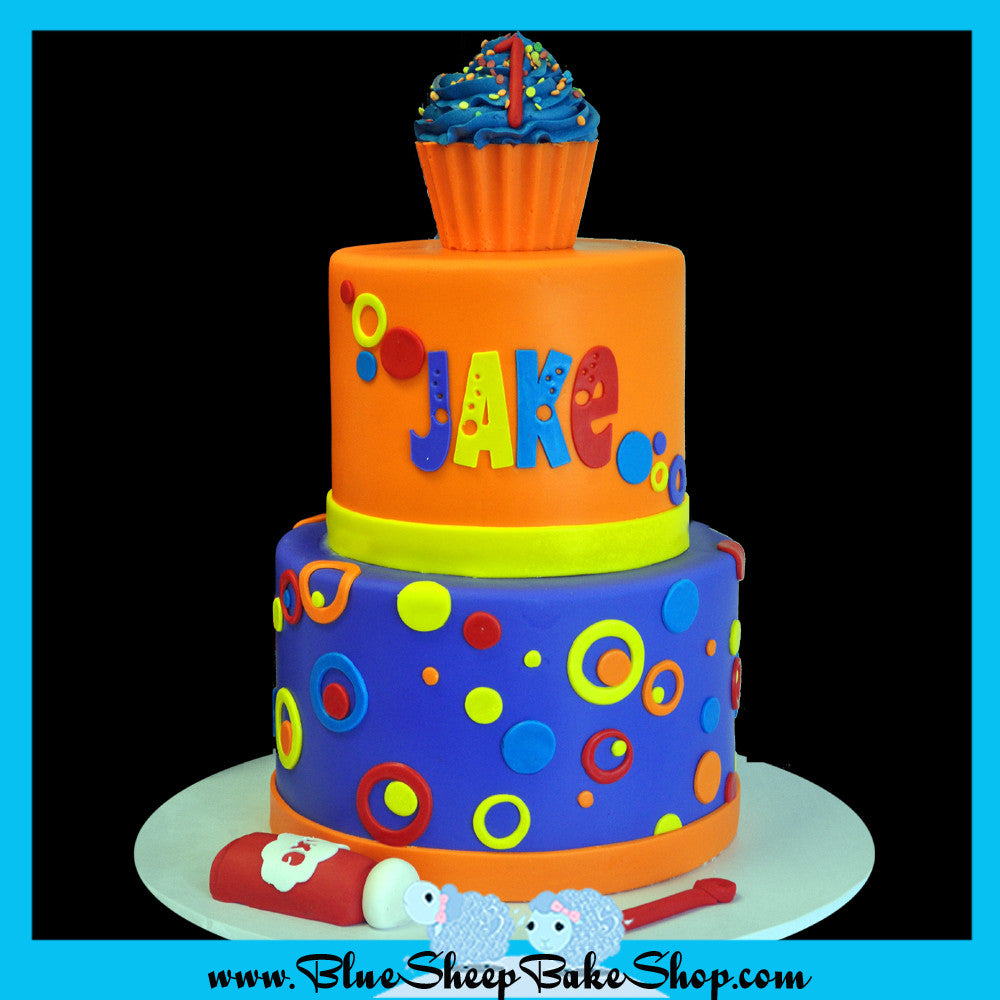 bubble birthday cake first birthday custom cake purple orange yellow red with a cupcake smash cake topper