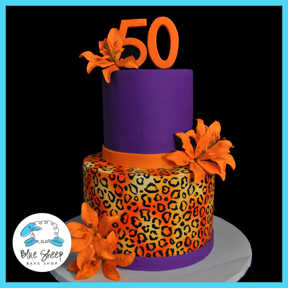 50th birthday cake with cheetah print and tiger lillies