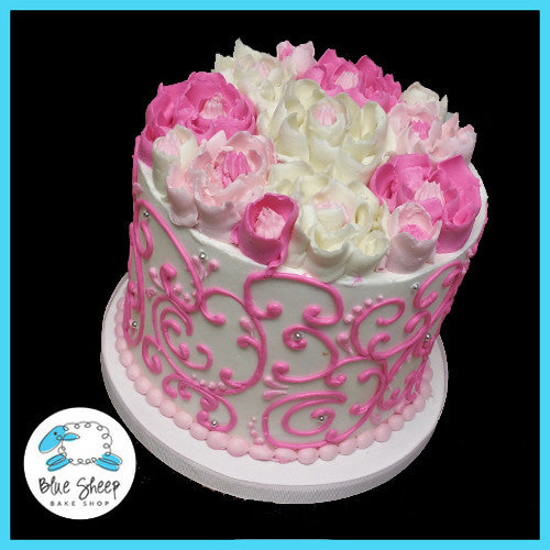 pink and white buttercream birthday cake