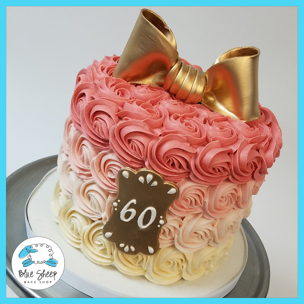 pink rosette ombre cake with gold bow nj