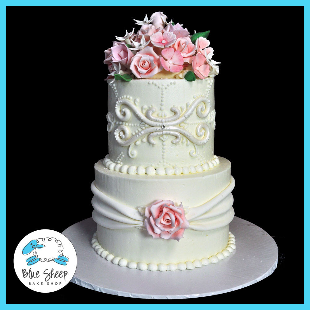 spring floral buttercream wedding cake with sugar flowers