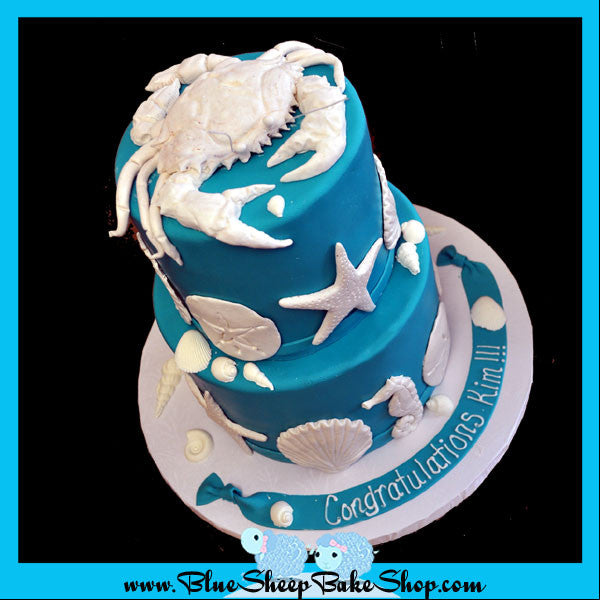 turquoise and white seashell wedding cake