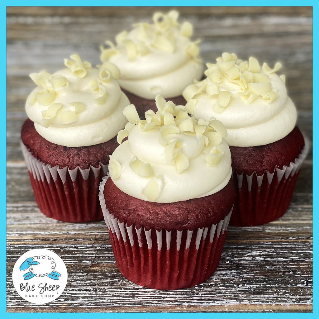 Red velvet cupcakes with cream cheese frosting and velvet crumb topping