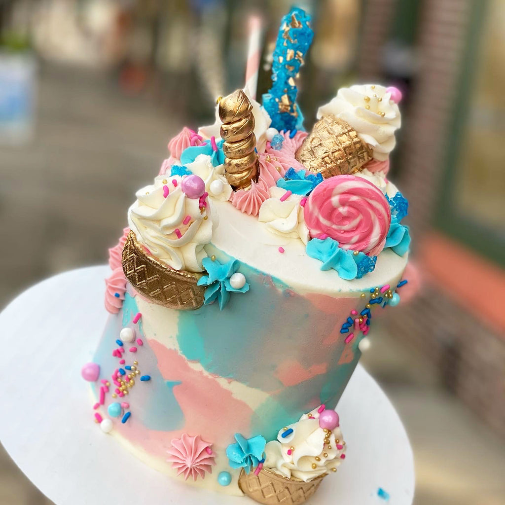 buttercream birthday cake with cones and candy