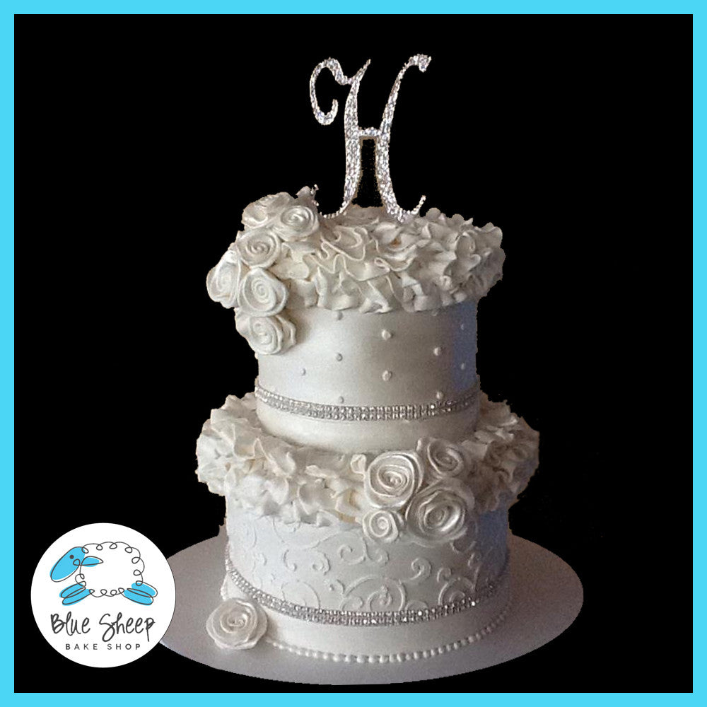 ruffles and roses wedding cake with stenciling and fondant roses and fondant ruffles