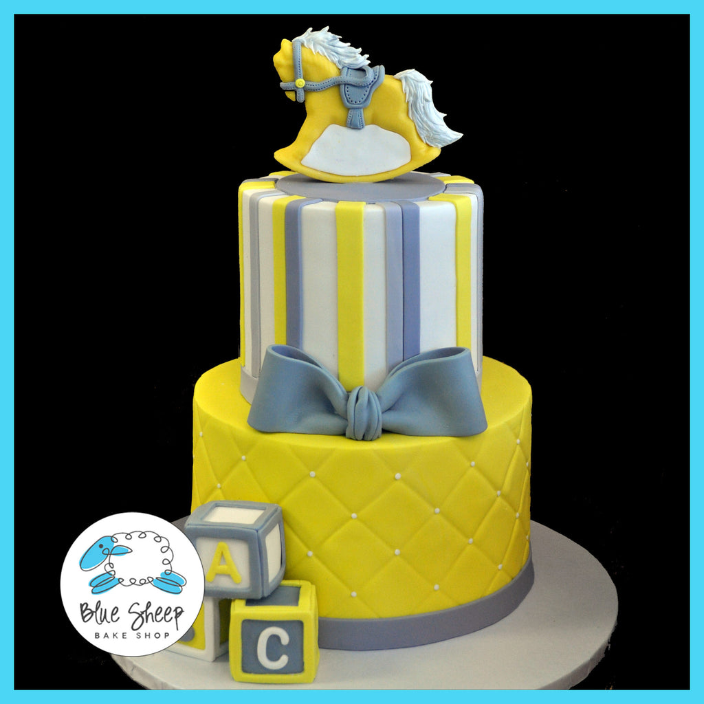 grey & yellow rocking horse baby shower cake